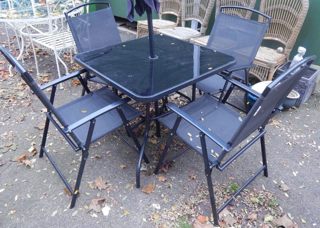 Appraisal: A black metal patio set comprising square table with glass