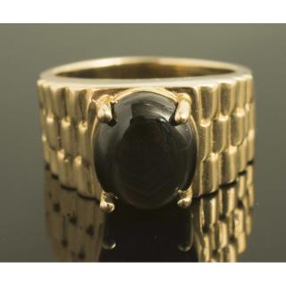 Appraisal: Black Star Sapphire Ring k yellow gold ring containing a