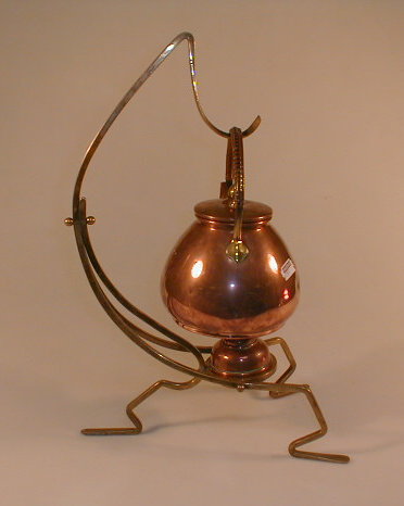 Appraisal: A German Arts Crafts copper and brass spirit kettle on