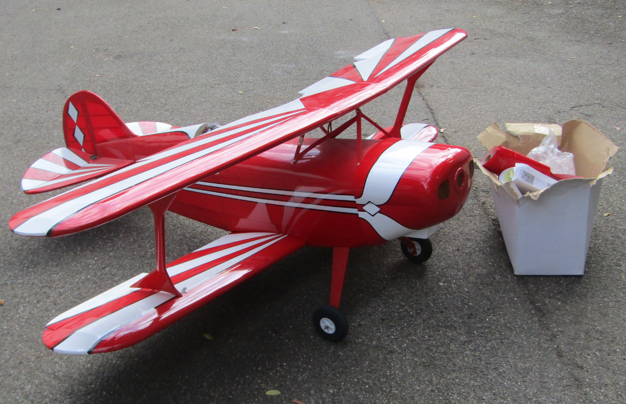 Appraisal: A remote controlled single propeller stunt by-plane in red and