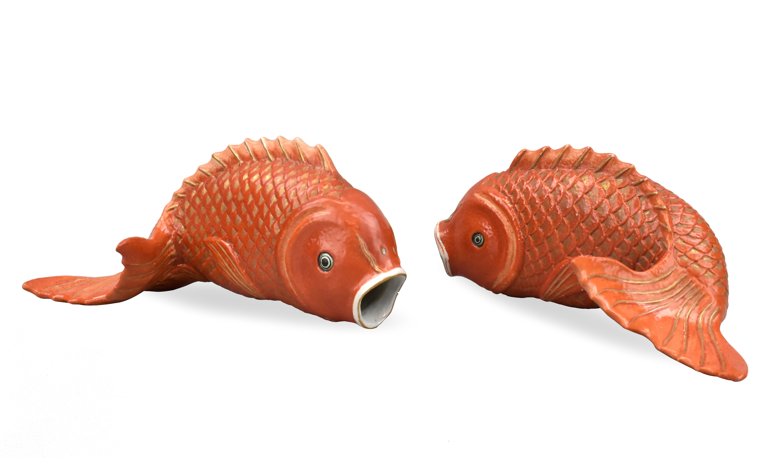 Appraisal: A pair of orange glazed porcelain carp wall vases th