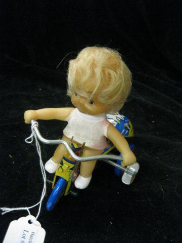 Appraisal: Tin Wind-Up Toy girl on bike