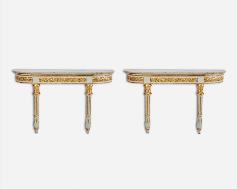 Appraisal: A pair of Louis XVI-style carved giltwood demi lune console