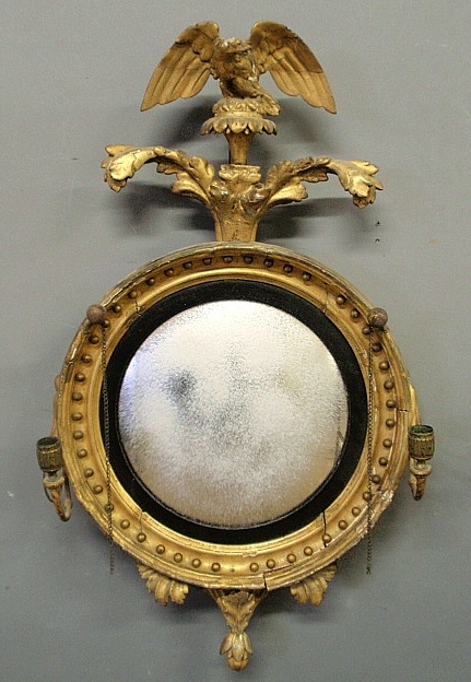 Appraisal: - Carved gilt girandole mirror c with foliate and eagle