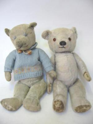 Appraisal: A Chad Valley teddy bear covered in faded worn blue