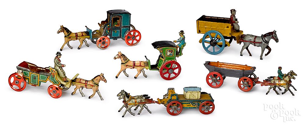 Appraisal: Six tin lithograph horse drawn penny toys Six tin lithograph