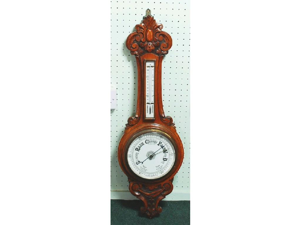 Appraisal: LATE VICTORIAN CARVED OAK ANEROID WHEEL BAROMETER the enamelled dial