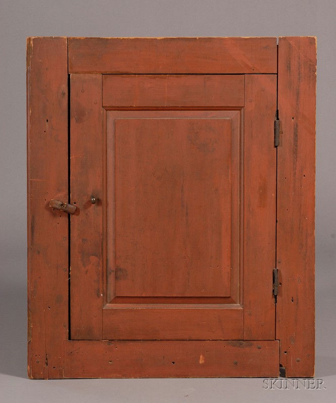 Appraisal: Red-painted Pine Chimney Cupboard New England early th century originally