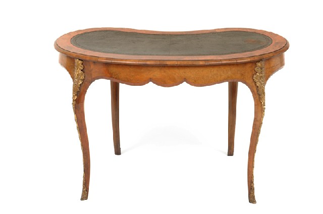 Appraisal: A VICTORIAN BURR WALNUT WRITING DESK The shaped leather inset