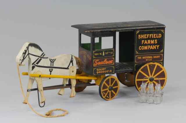 Appraisal: RICH TOY SHEFFIELD FARMS DAIRY WAGON Wooden enclosed wagon with