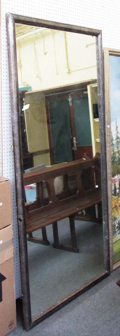 Appraisal: A large early th century silver framed rectangular wall mirror