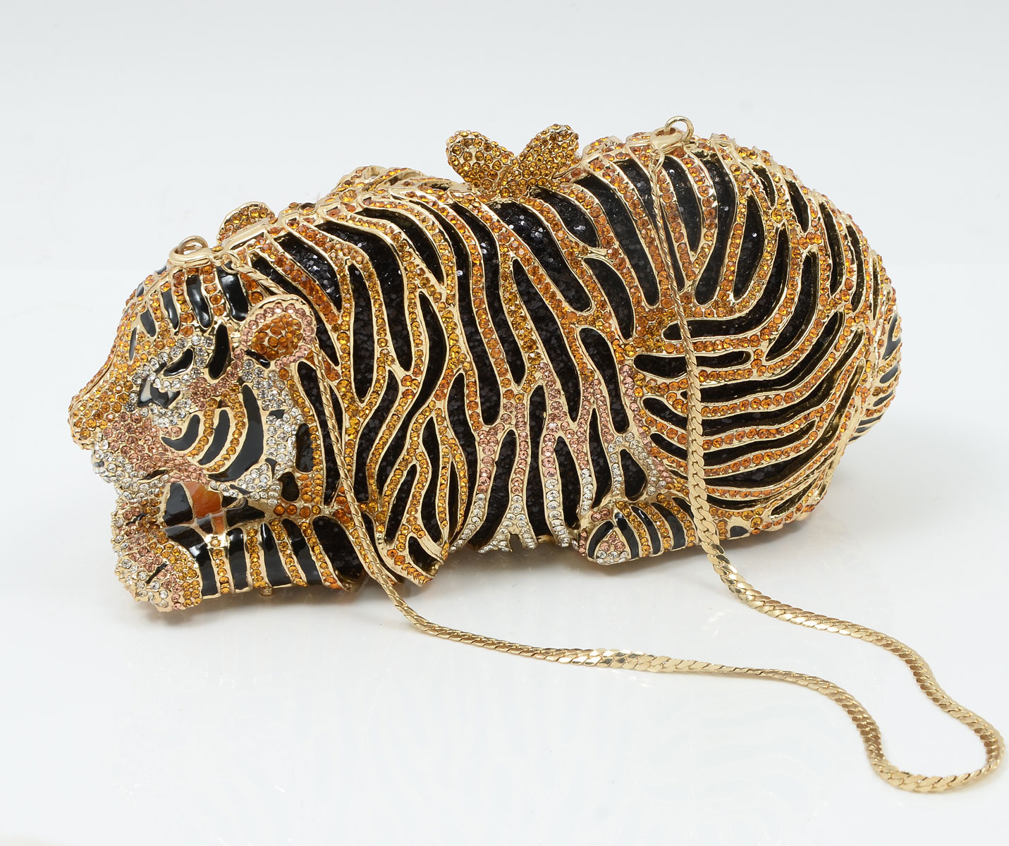 Appraisal: OFF PARK COLLECTION CRYSTAL ENAMEL TIGER CLUTCH Round yellow white