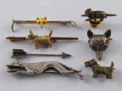 Appraisal: A mixed lot of seven brooches tie clips including a