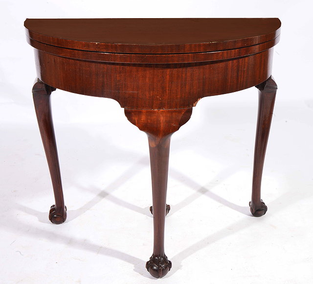 Appraisal: A GEORGIAN STYLE 'D' SHAPED MAHOGANY FOLD OVER CARD TABLE