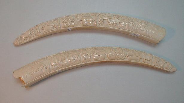 Appraisal: A pair of early thC African ivory elephant tusks carved