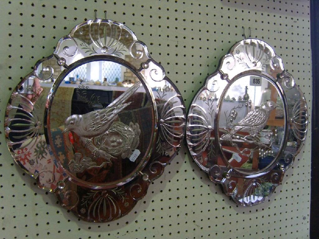 Appraisal: A pair of Venetian glass mirrors of shaped form with