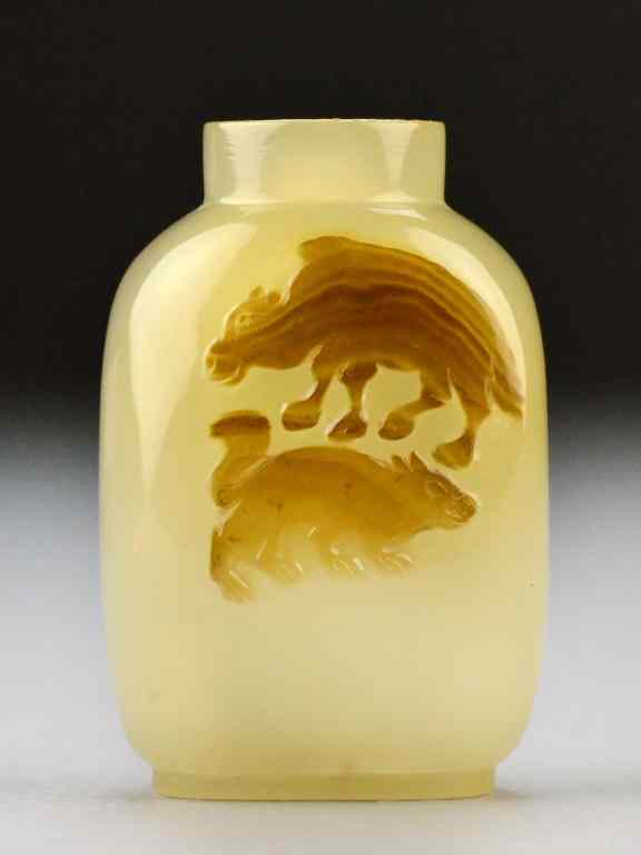 Appraisal: A Fine Chinese Qing Carved Agate Snuff BottleThe opaque and