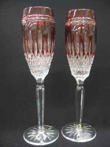 Appraisal: Pair of Waterford Ruby Cut-to-Clear tall fluted champagnes '' signed