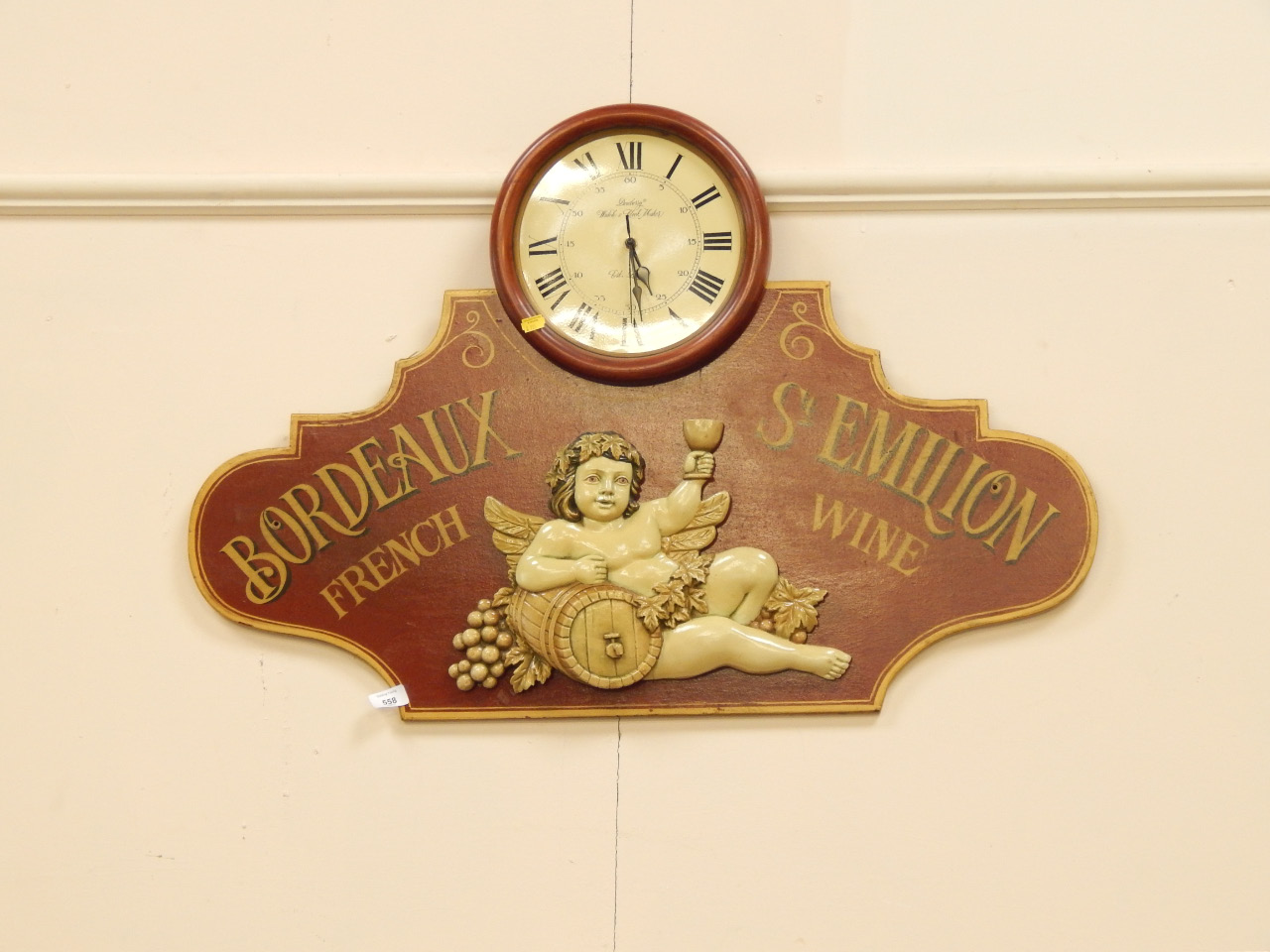 Appraisal: Decorative advertising hanging wall clock by Dewbury Watch Clock Company