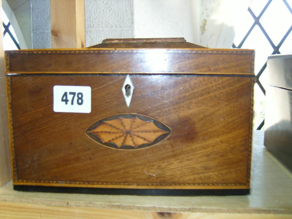 Appraisal: A Georgian mahogany caddy with string and chequered inlay and