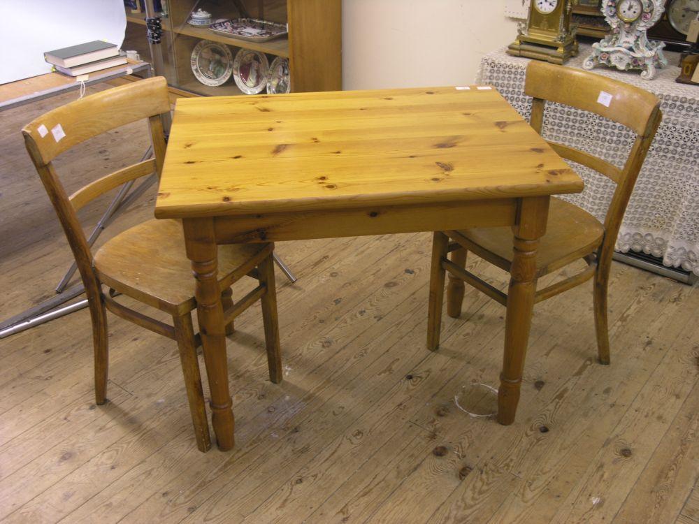 Appraisal: A modern pine kitchen table and two kitchen chairs