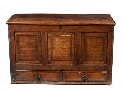 Appraisal: An oak chest with panelled front fitted two drawers cm