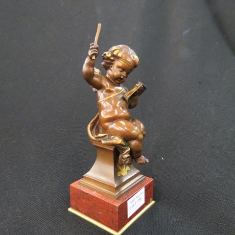 Appraisal: French Bronze Statue of a Cherub seated with book of