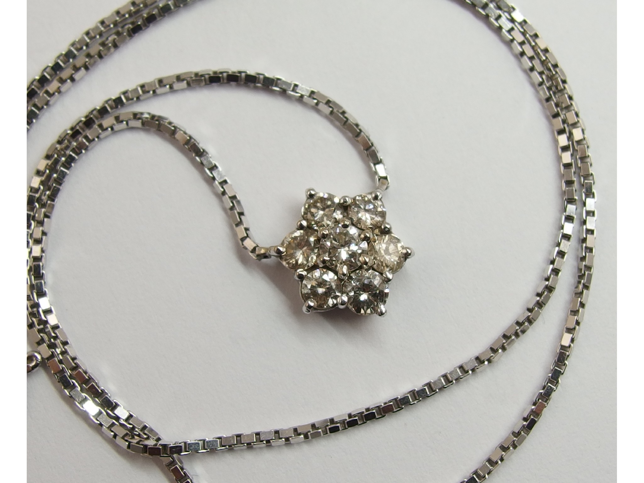 Appraisal: An ct diamond flower pendantwith a combined total of approximately