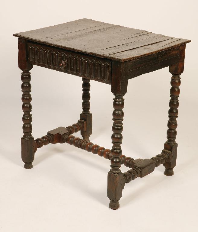 Appraisal: A CHARLES II STYLE OAK SIDE TABLE the rectangular top