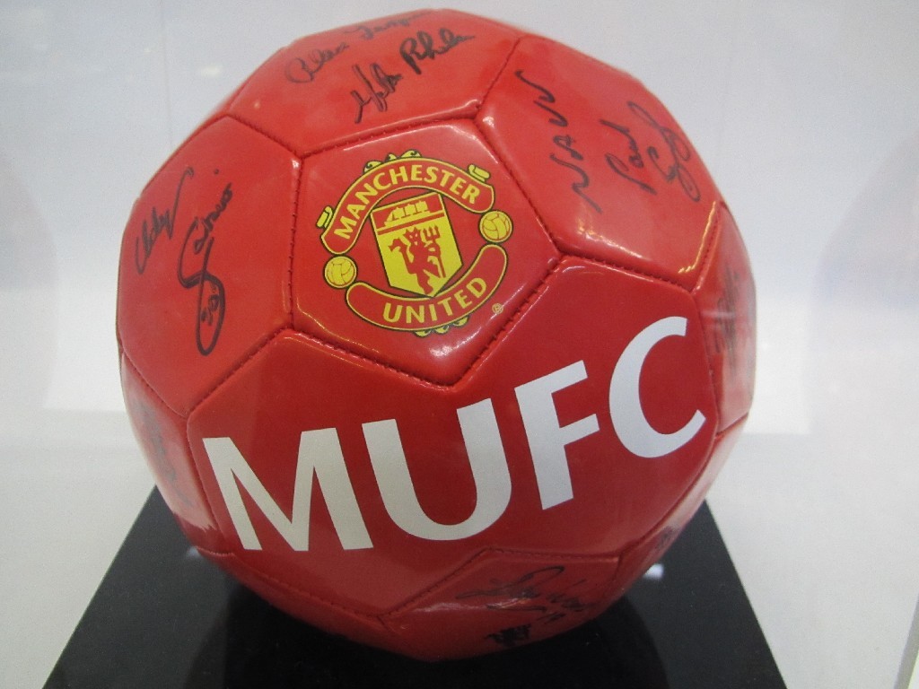 Appraisal: Mounted and framed Manchester United team top signed by Alex