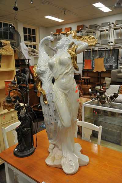 Appraisal: A WHITE PORCELAIN STATUE DEPICTING A GRECIAN FIGURE