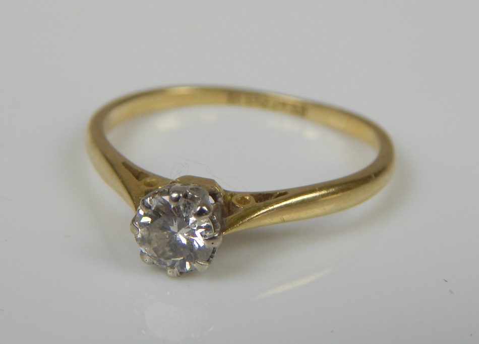 Appraisal: A diamond solitaire ring the central round brilliant stone yellow