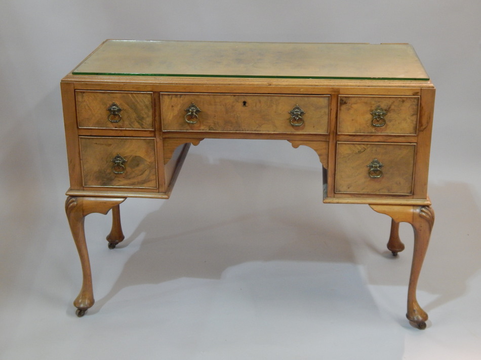 Appraisal: An early thC walnut dressing table the top with a