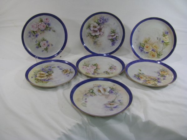 Appraisal: Seven hand painted floral German porcelain plates signed Marge Wilder