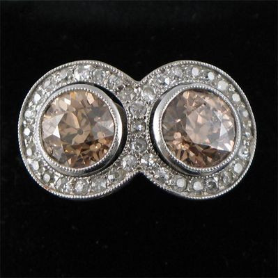 Appraisal: A diamond two stone ring the two cinnamon coloured brilliant