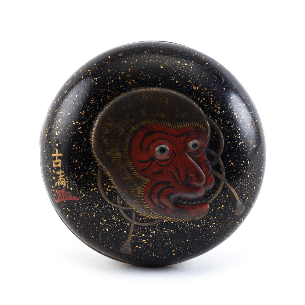 Appraisal: JAPANESE BLACK AND GOLD LACQUER MANJU MID- TH CENTURY DIAMETER