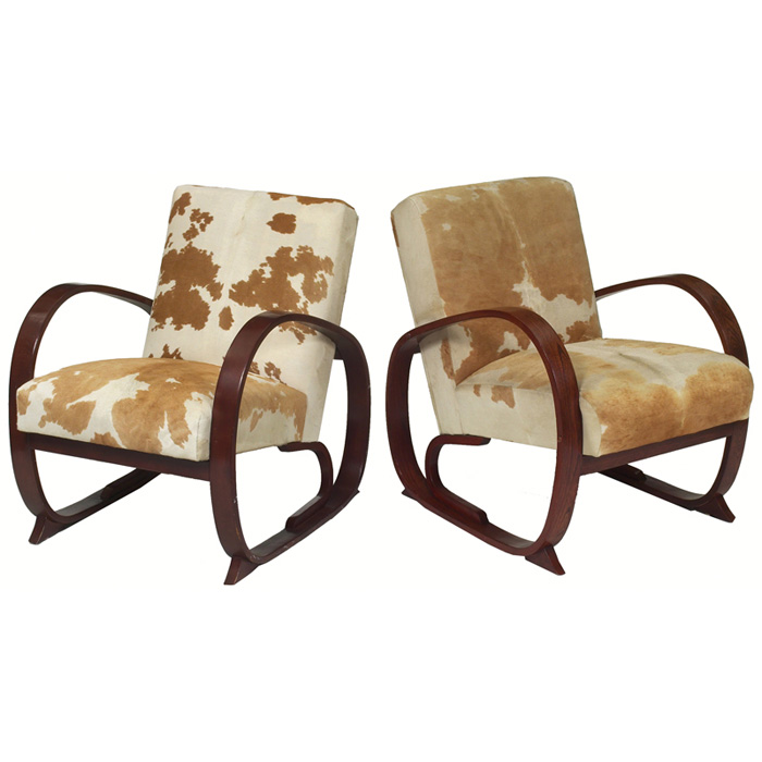 Appraisal: Art Deco lounge chairs two maker unknown cowhide upholstered seats