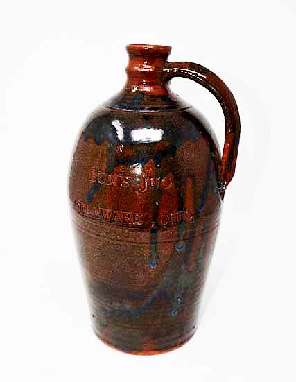 Appraisal: Brown crock jug Brown crock jug marked Buns Jug Delaware