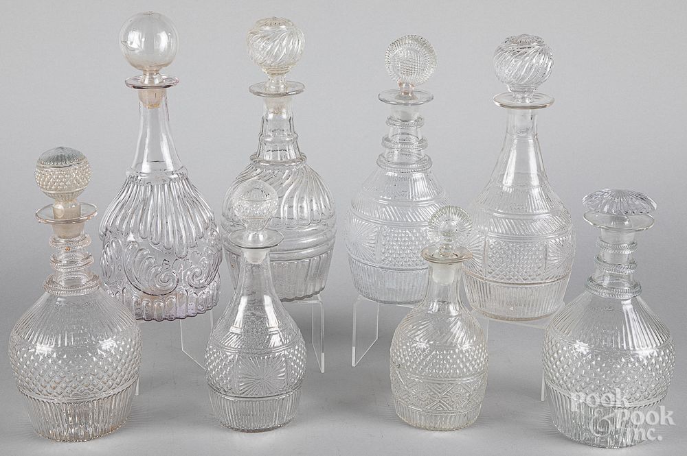 Appraisal: Eight colorless glass decanters th c Eight colorless glass decanters