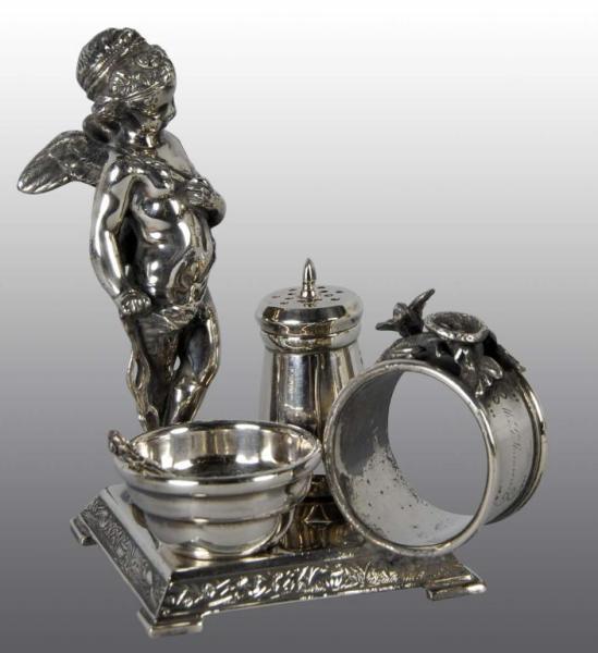 Appraisal: Winged Cherub Figural Napkin Ring Combination Set Description Wilcox Includes