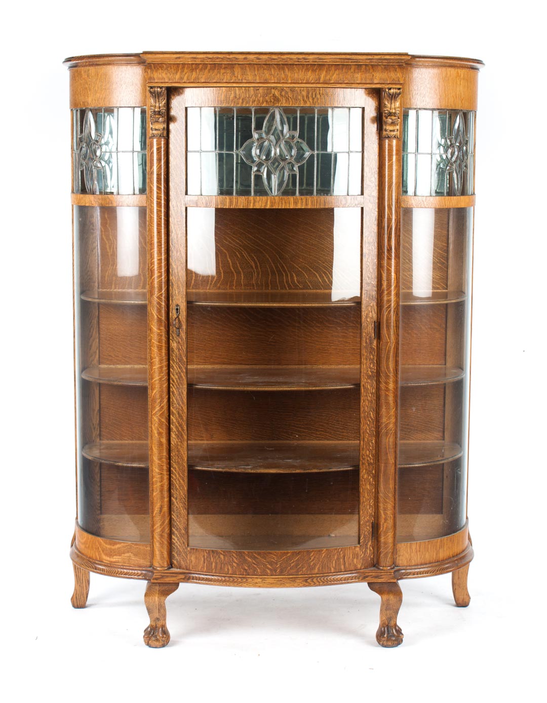 Appraisal: American Renaissance Revival oak china cabinet circa bow-front leaded glass