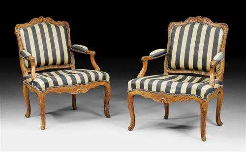 Appraisal: PAIR OF CARVED BEECHWOOD FAUTEUILS R gence Paris circa Caned