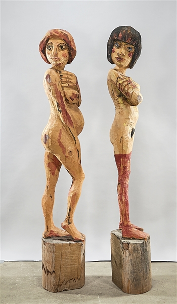 Appraisal: Two contemporary partially painted wood female figural sculptures x x