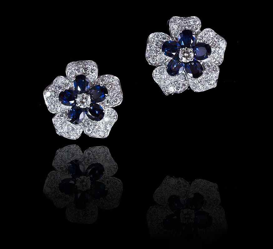 Appraisal: K DIAMOND AND SAPPHIRE EARRINGS K white gold flower form