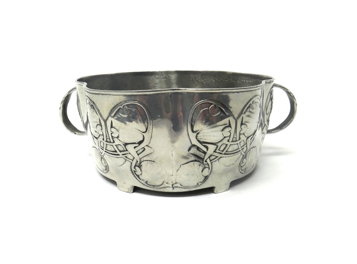 Appraisal: A Liberty Co Tudric pewter two handled bowl relief cast