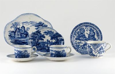 Appraisal: Three blue and white cups and saucers one printed with