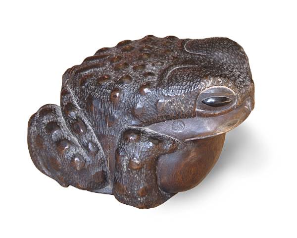 Appraisal: A Japanese carved wood okimono of a toad Meiji Period