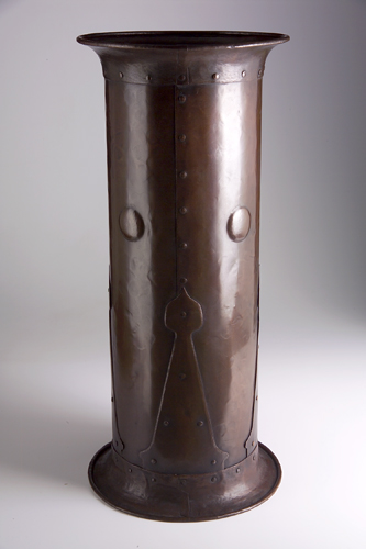 Appraisal: GUSTAV STICKLEY Hammered copper umbrella stand with riveted strap hardware