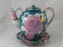 Appraisal: A very large Russian porcelain barge teapot on plate stand