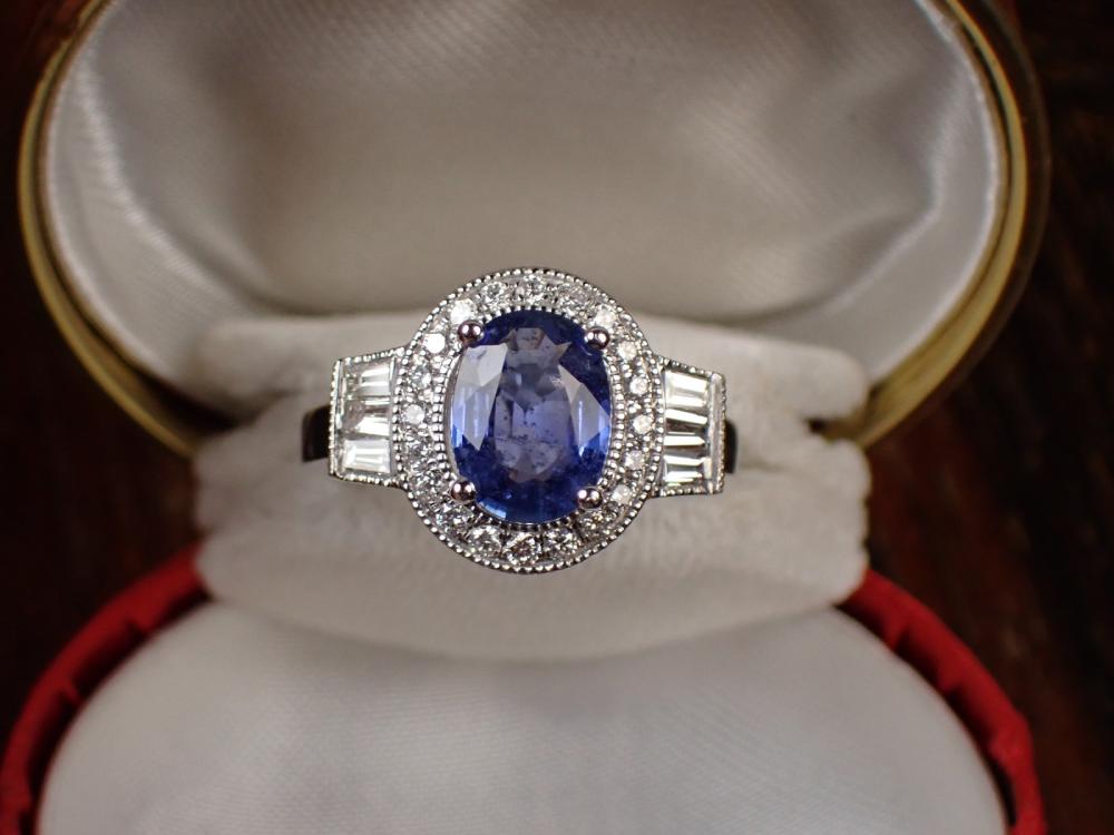 Appraisal: BLUE SAPPHIRE DIAMOND AND PLATINUM RING with round full-cut diamonds